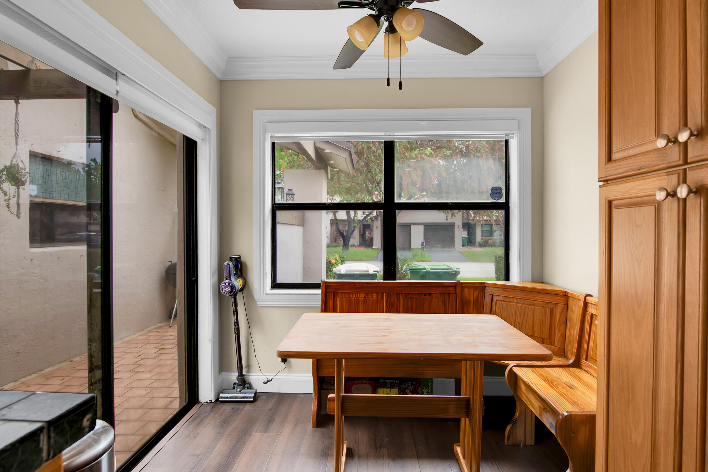 8203 Northwest 100th Way Tamarac, FL 33321 - Photo 7 of 31 a view of a dining room with furniture window and wooden floor