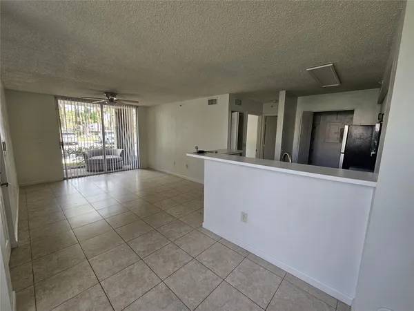 a view of a kitchen with furniture and staircase