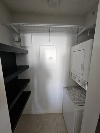 a view of storage and utility room with racks on the wall