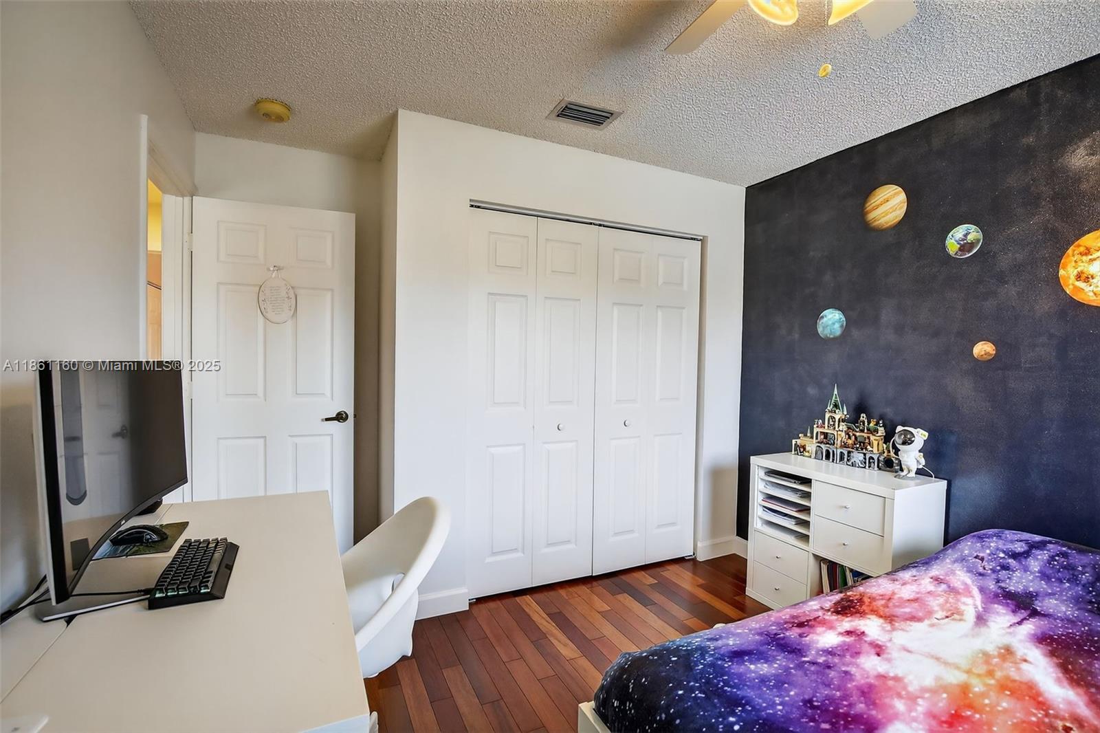 3989 Pinewood Lane Weston, FL 33331 - Photo 31 of 53 a bedroom with a bed and a flat screen tv