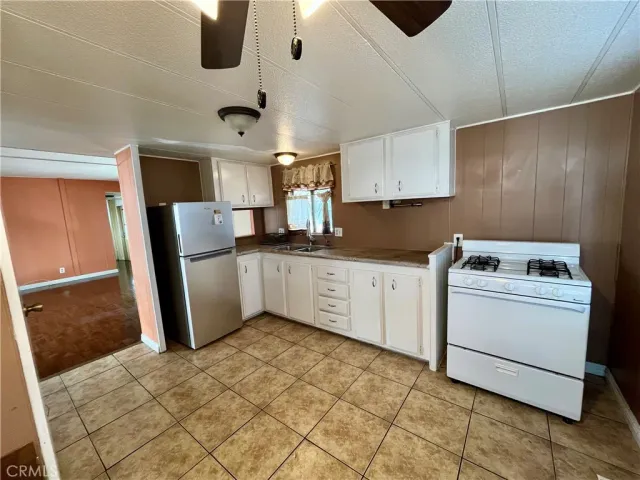 a bathroom with a granite countertop toilet and a bathtub