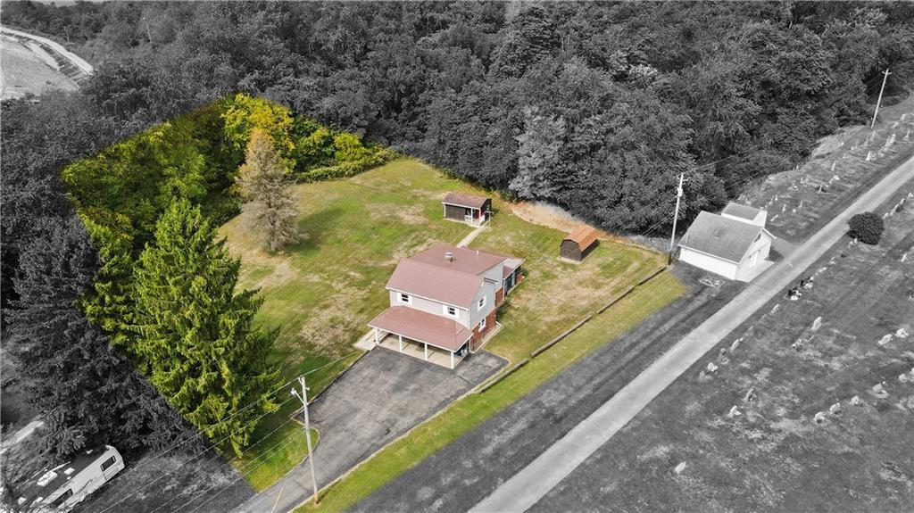 335 Spring Street Yukon, PA 15698 - Photo 2 of 24 SITUATED ON ABOUT 3/4 OF AN ACRE, ITS LEVEL, AND 3 SIDES ARE SURROUNDED BY TREES! AWESOME!