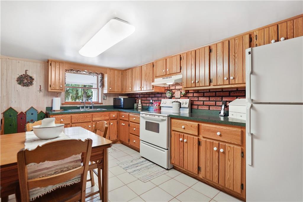 335 Spring Street Yukon, PA 15698 - Photo 5 of 24 ANOTHER VIEW OF THE EAT IN KITCHEN, WITH A WINDOW ABOVE THE SINK ALLOWING NATURAL LIGHTING IN WHILE YOU DO CLEAN UP! :)