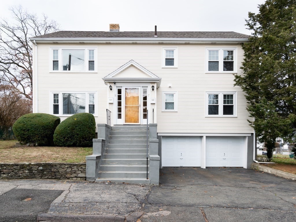 a front view of a house with a garage