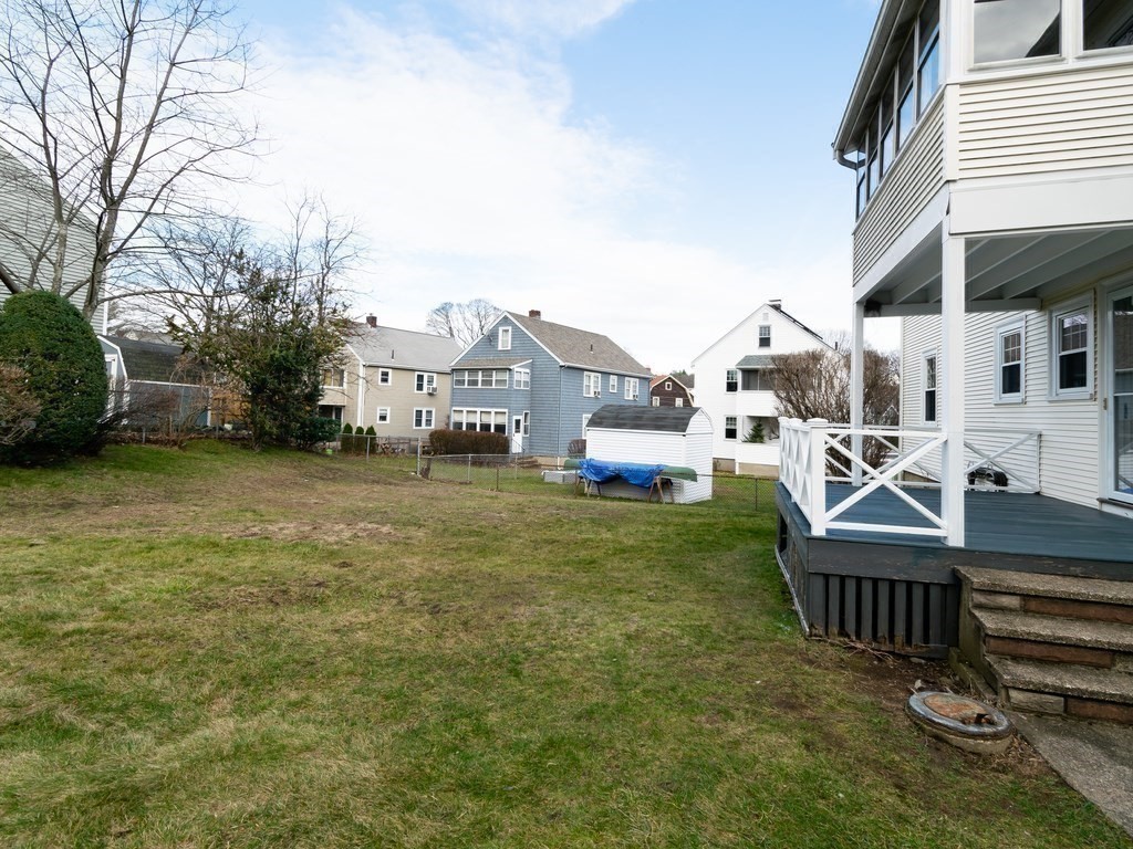 7 Mangano Court, Unit 2 Watertown, MA 02472 - Photo 13 of 14 a view of a house with backyard and sitting area