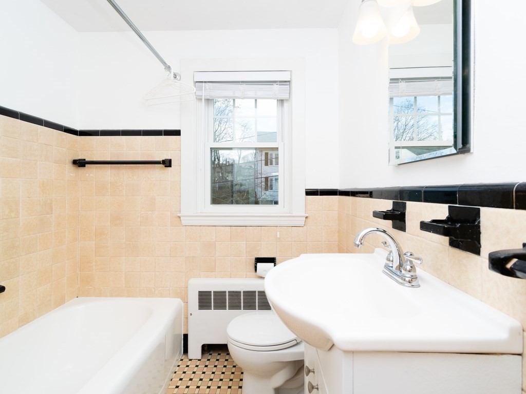 7 Mangano Court, Unit 2 Watertown, MA 02472 - Photo 7 of 14 a bathroom with a sink a toilet and a bathtub