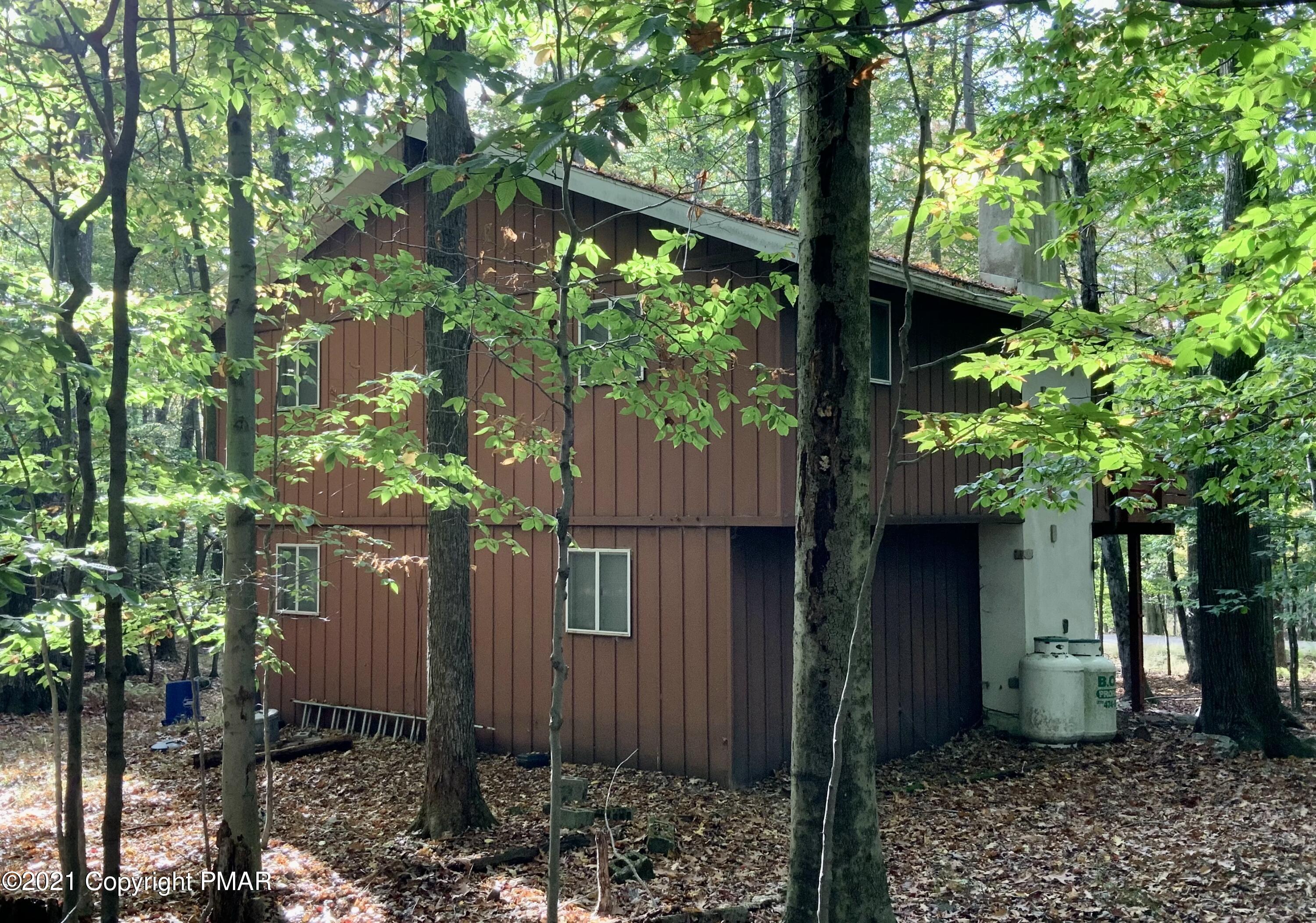 140 Elk Run Road Pocono Lake, PA 18347 - Photo 3 of 38 Side View