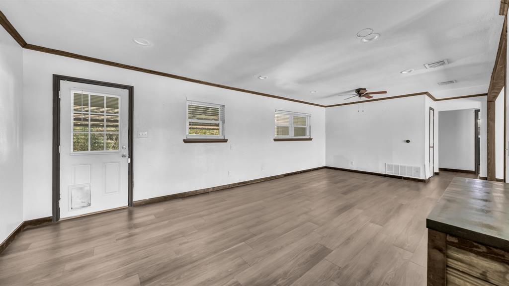 760 College Farm Road Stephenville, TX 76401 - Photo 12 of 32 a view of a livingroom with wooden floor