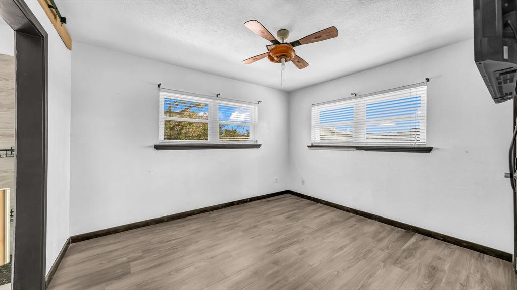 760 College Farm Road Stephenville, TX 76401 - Photo 21 of 32 a view of empty room with wooden floor