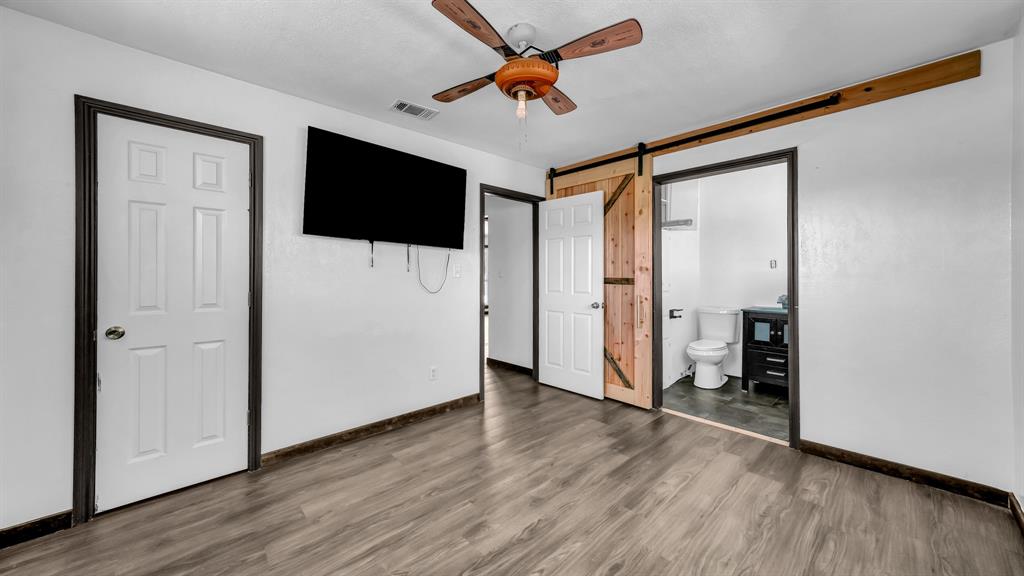 760 College Farm Road Stephenville, TX 76401 - Photo 22 of 32 wooden floor in an empty room