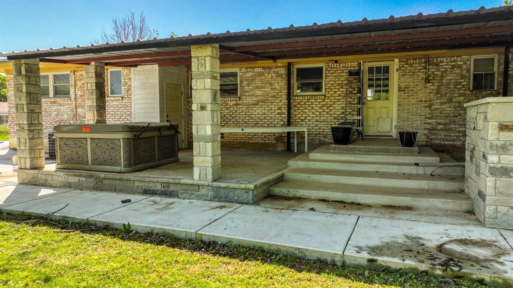 760 College Farm Road Stephenville, TX 76401 - Photo 24 of 32 a front view of a house with a garden
