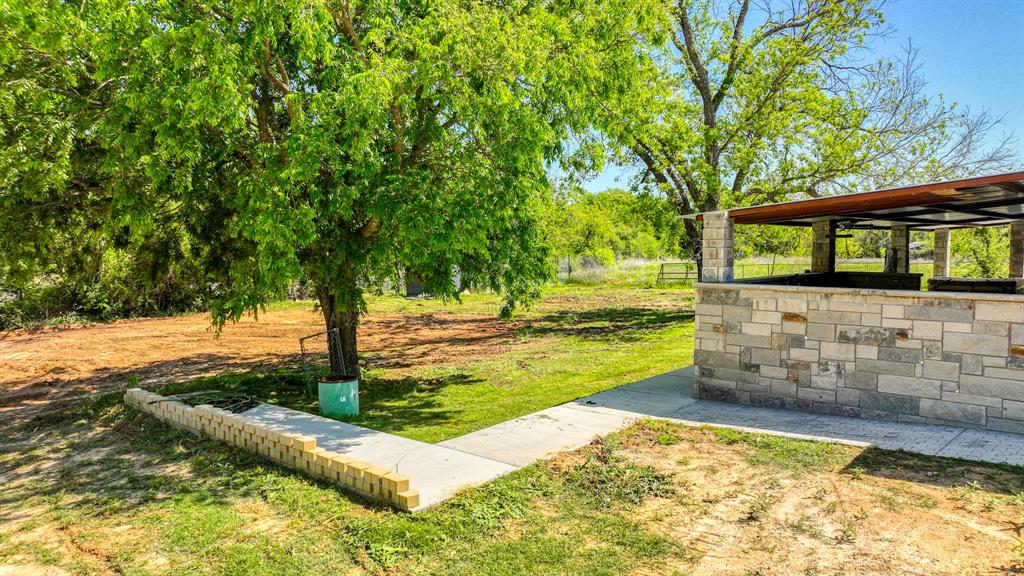 760 College Farm Road Stephenville, TX 76401 - Photo 27 of 32 a view of a yard with swimming pool