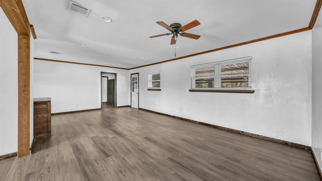 760 College Farm Road Stephenville, TX 76401 - Photo 6 of 32 a view of empty room with wooden floor