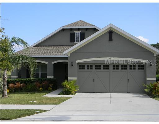 20922 Sullivan Ranch Boulevard Mount Dora, FL 32757 - Photo 1 of 1 a front view of a house with a garden