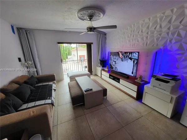 a living room with furniture and a window