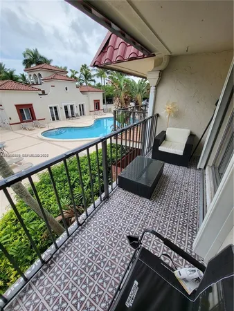 a view of balcony with wooden floor