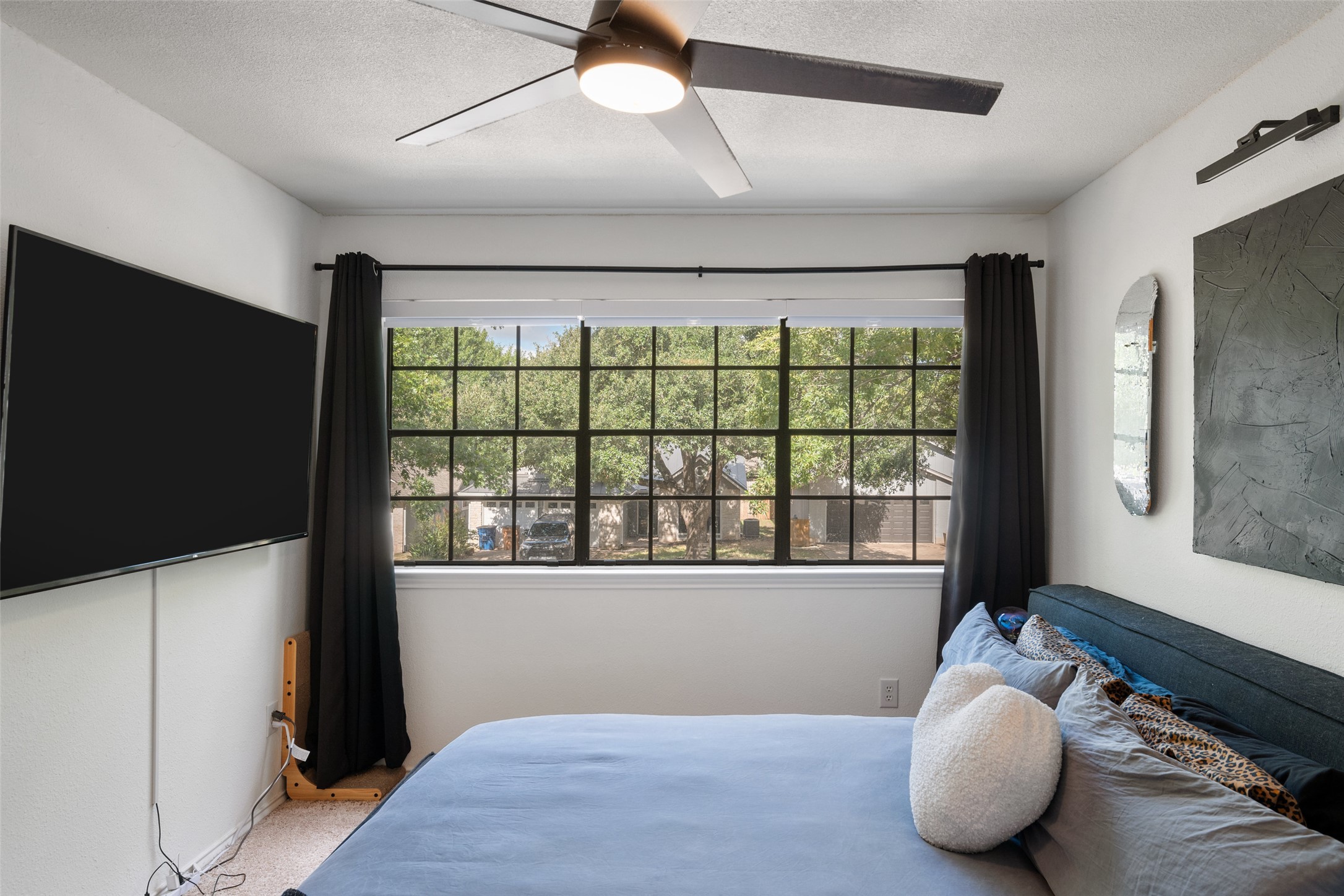 9833 Briar Ridge Drive Austin, TX 78748 - Photo 13 of 29 Carpeted bedroom with ceiling fan and a textured ceiling