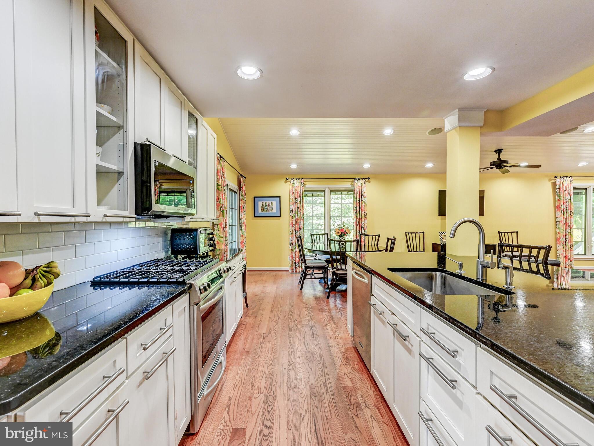 265 Hunters Ridge Road Lutherville-Timonium, MD 21093 - Photo 11 of 42 a kitchen with stainless steel appliances granite countertop sink stove and cabinets