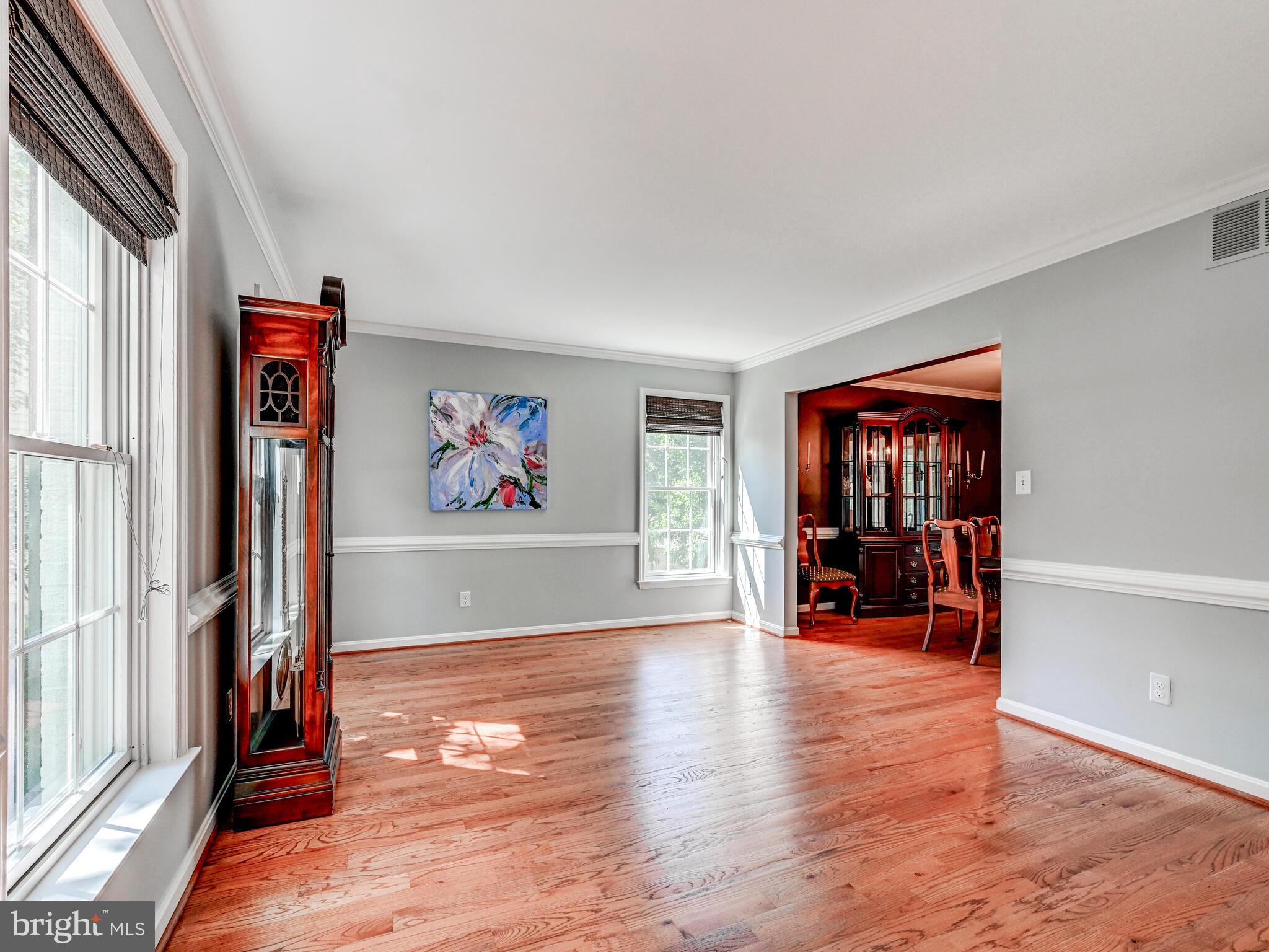 265 Hunters Ridge Road Lutherville-Timonium, MD 21093 - Photo 17 of 42 an empty room with piano and wooden floor