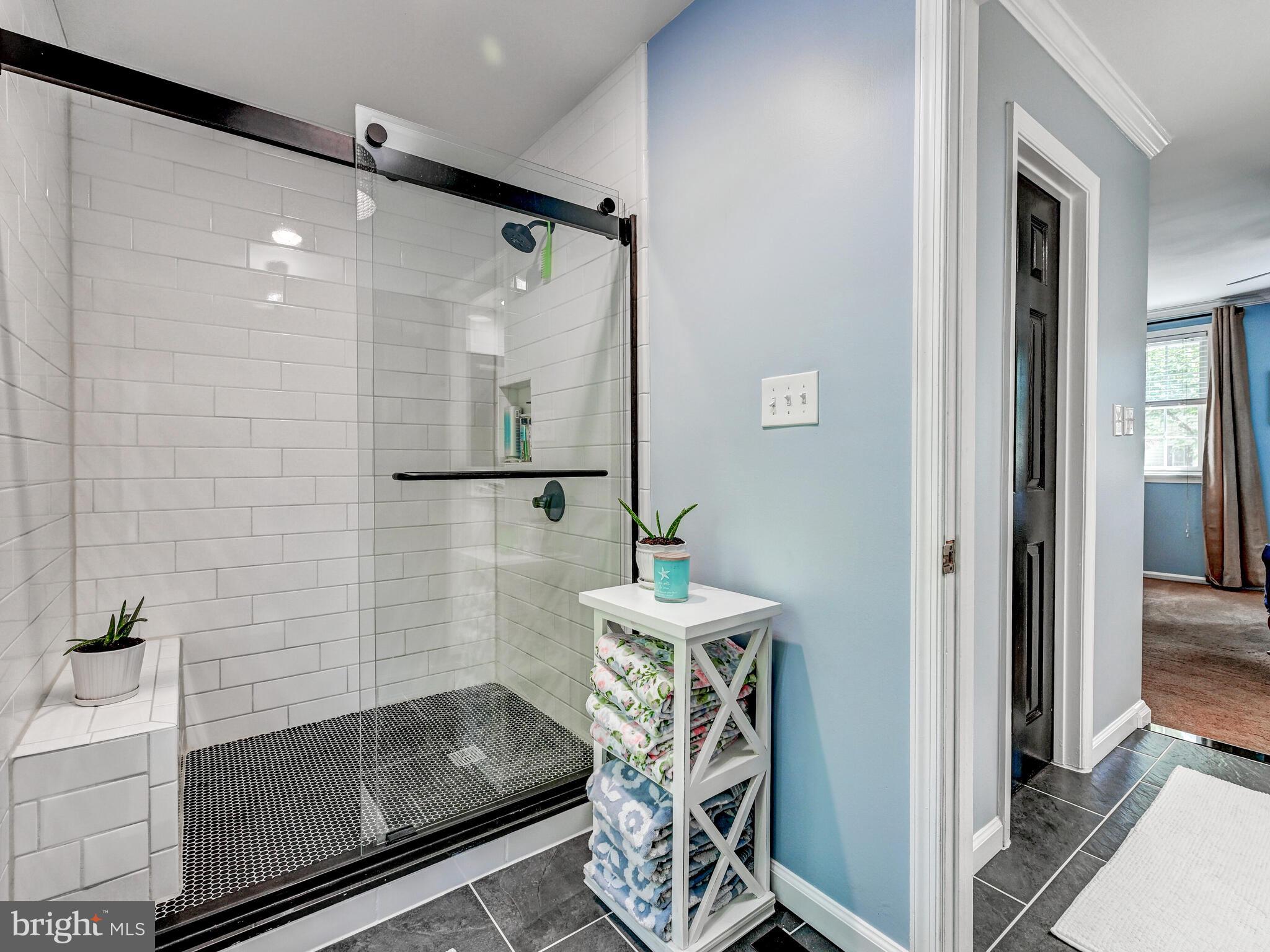 265 Hunters Ridge Road Lutherville-Timonium, MD 21093 - Photo 21 of 42 a bathroom with a bathtub and a shower