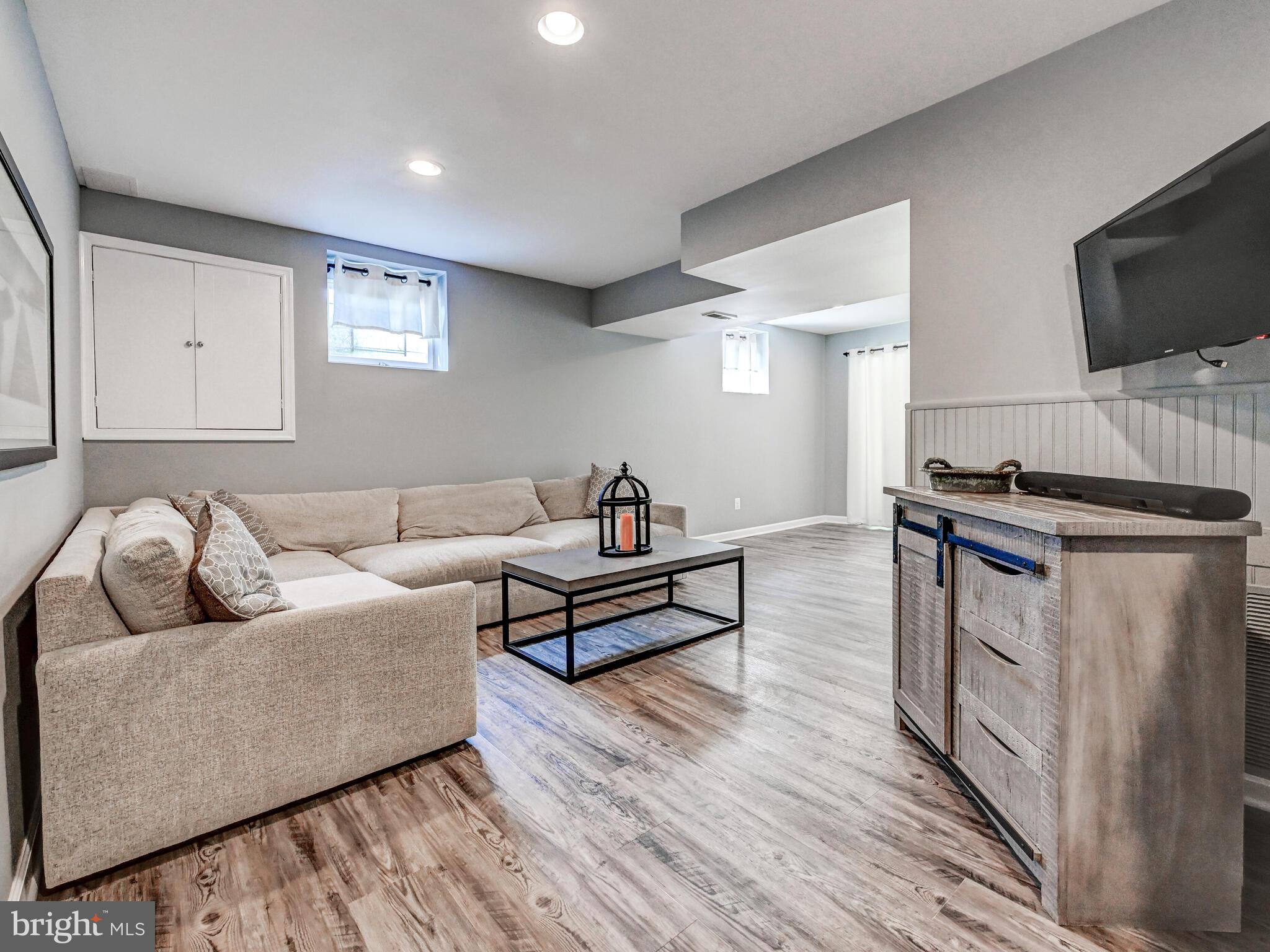 265 Hunters Ridge Road Lutherville-Timonium, MD 21093 - Photo 25 of 42 a living room with furniture and a flat screen tv