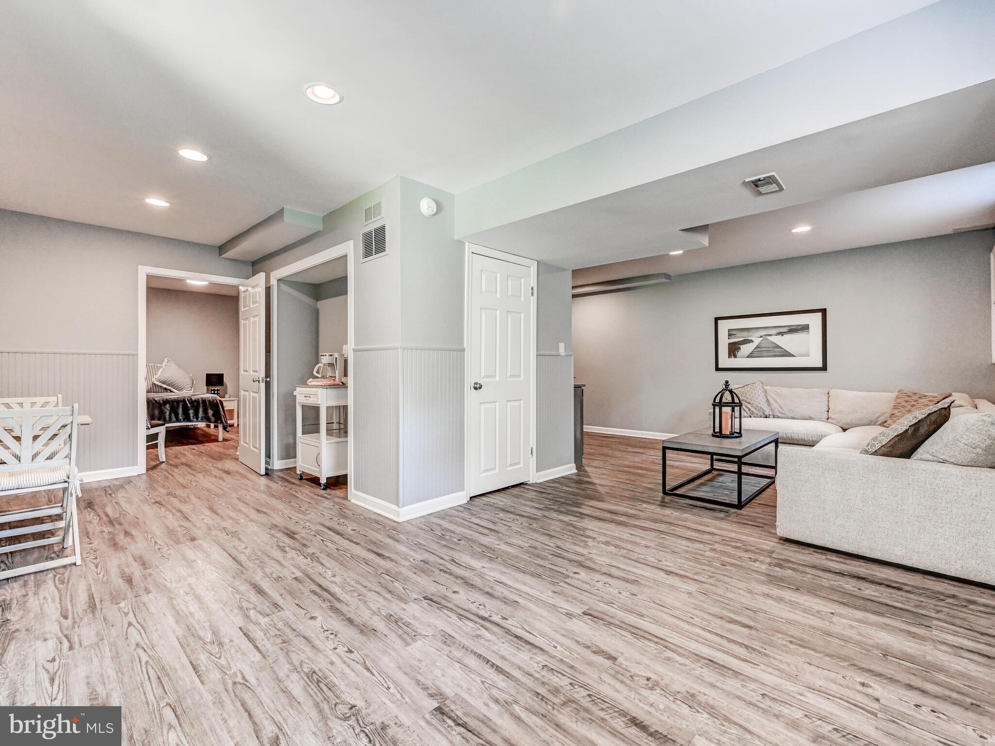 265 Hunters Ridge Road Lutherville-Timonium, MD 21093 - Photo 26 of 42 a living room with furniture and a wooden floor