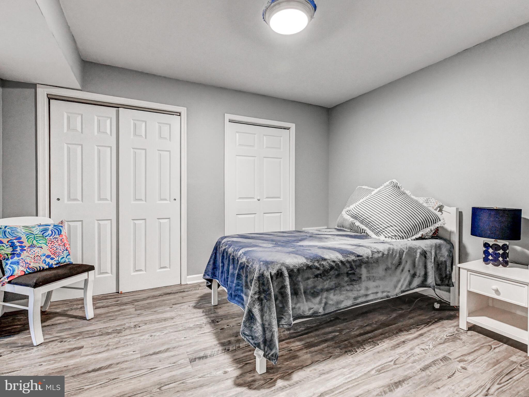 265 Hunters Ridge Road Lutherville-Timonium, MD 21093 - Photo 27 of 42 a bedroom with a bed and wooden floor