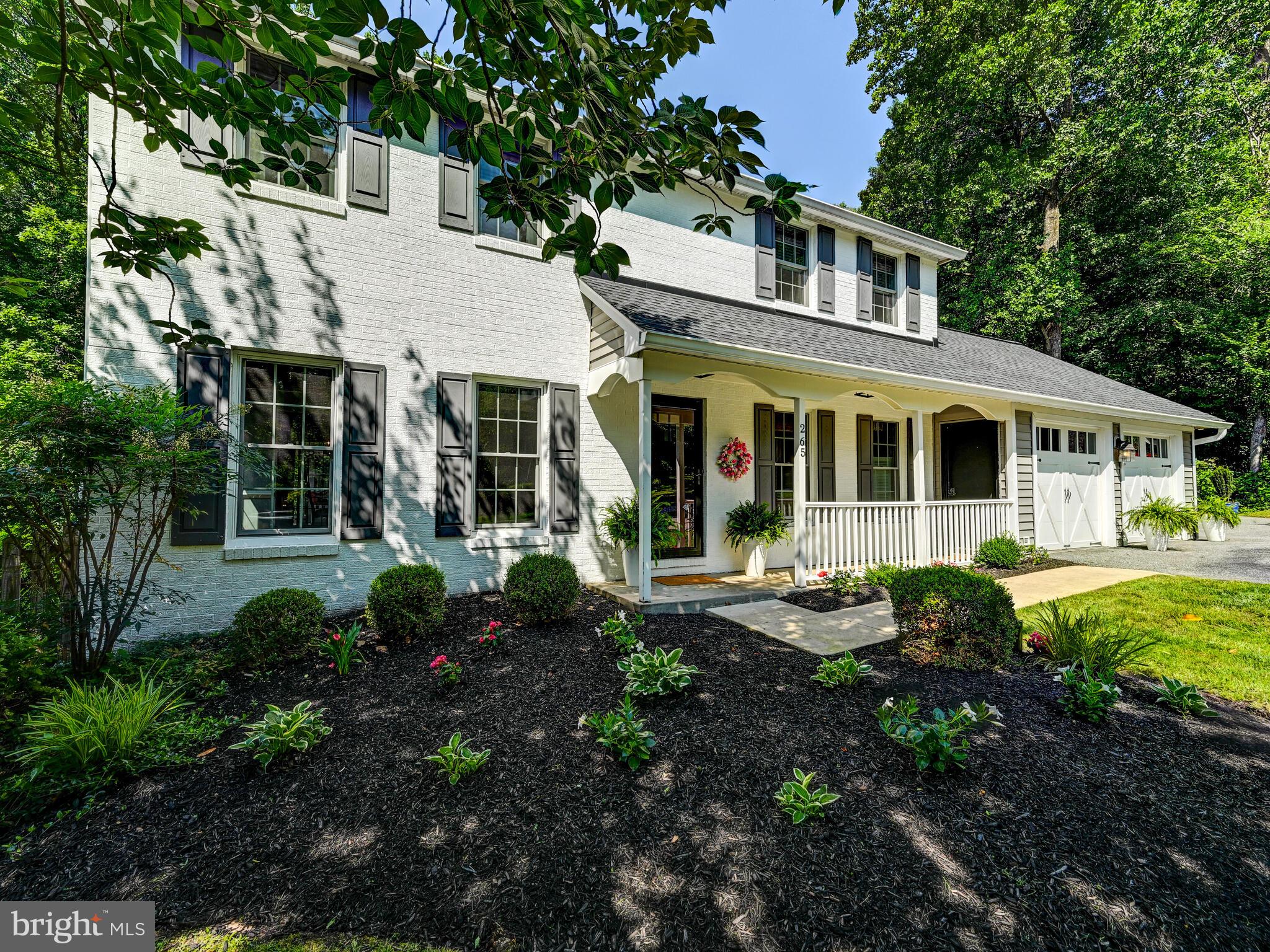 265 Hunters Ridge Road Lutherville-Timonium, MD 21093 - Photo 3 of 42 a front view of a house with garden