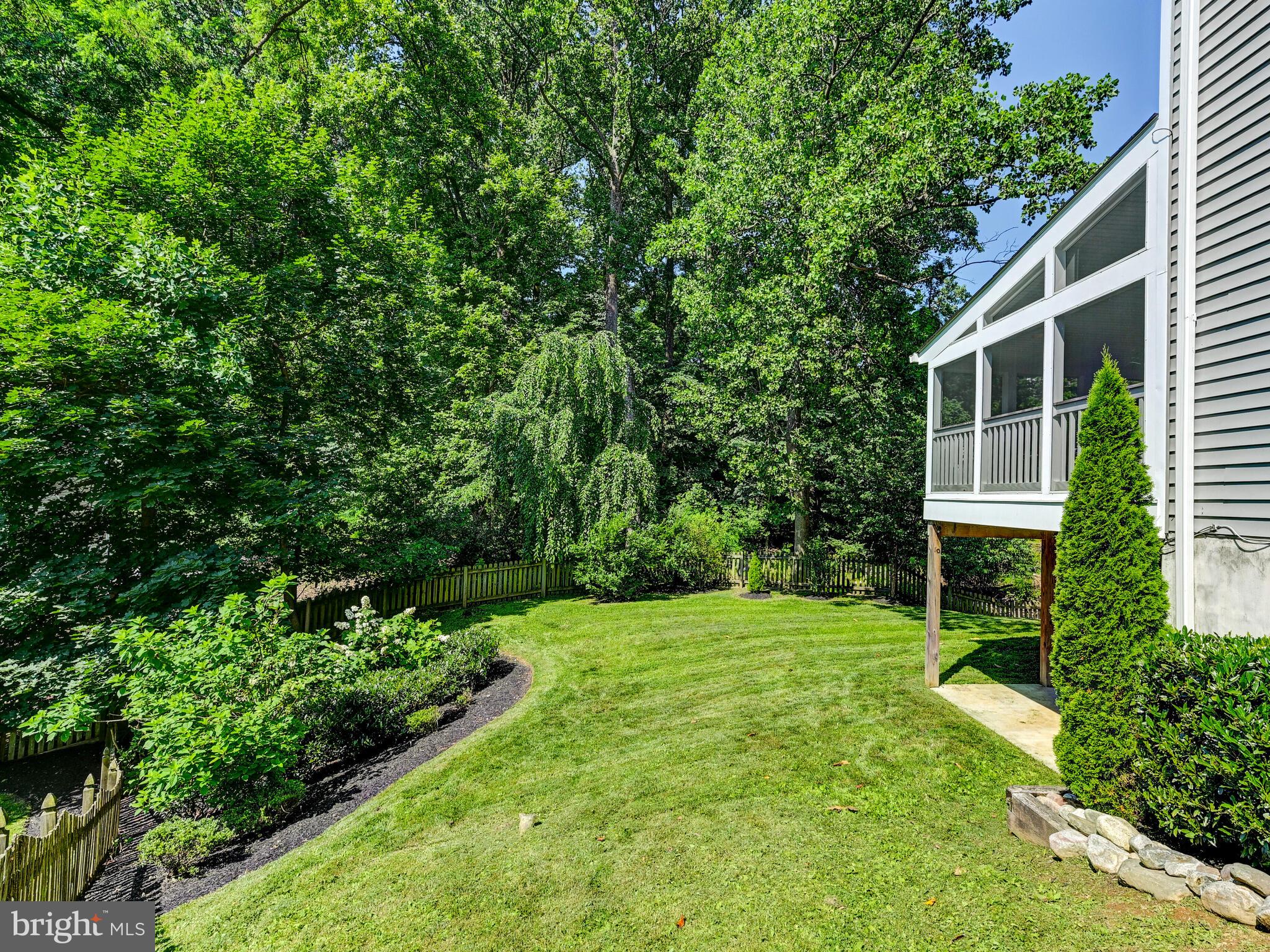 265 Hunters Ridge Road Lutherville-Timonium, MD 21093 - Photo 37 of 42 a view of a backyard with couches plants and large trees