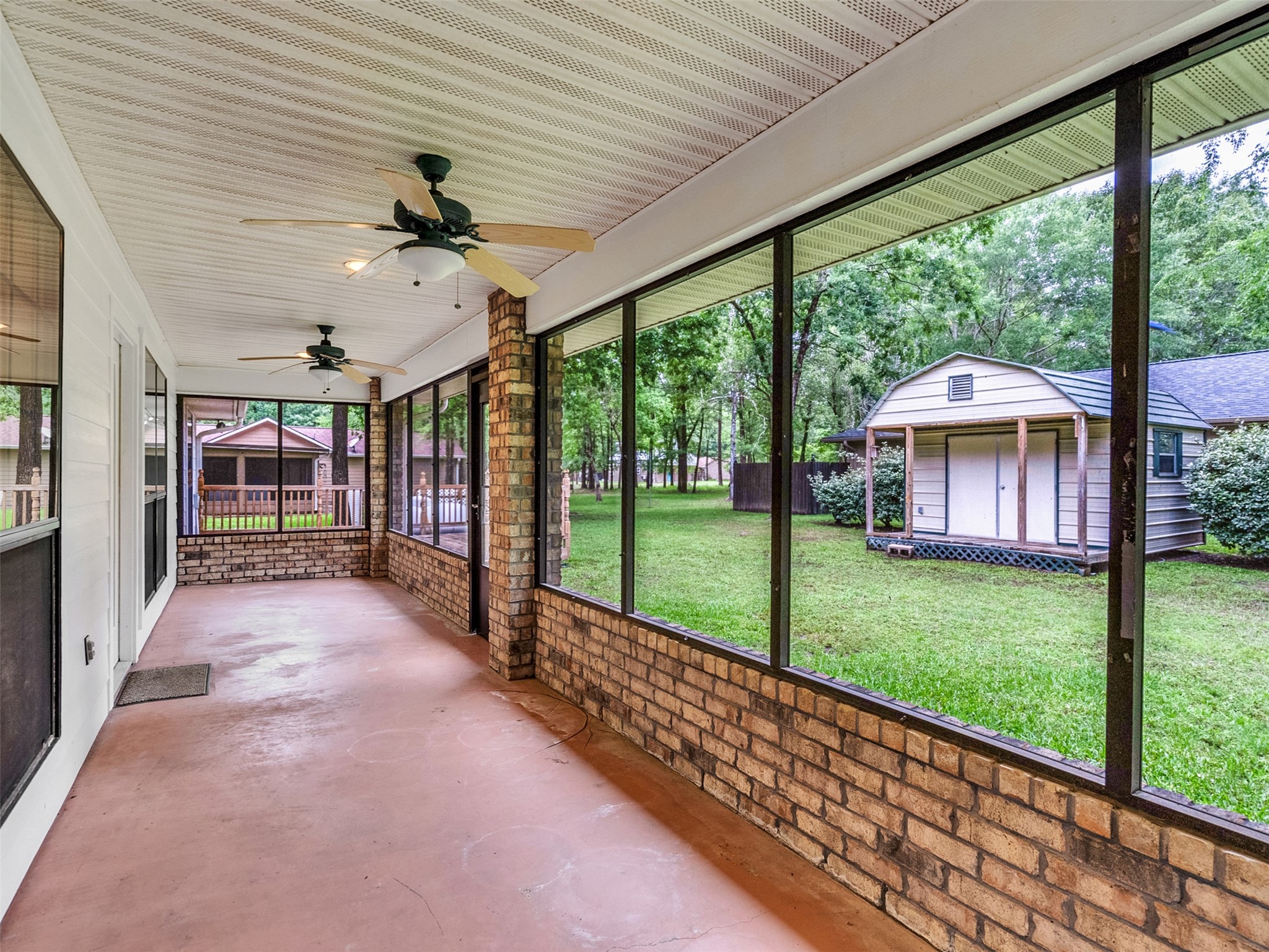 195 Coral Gables Trinity, TX 75862 - Photo 32 of 50 a view of a porch with a backyard