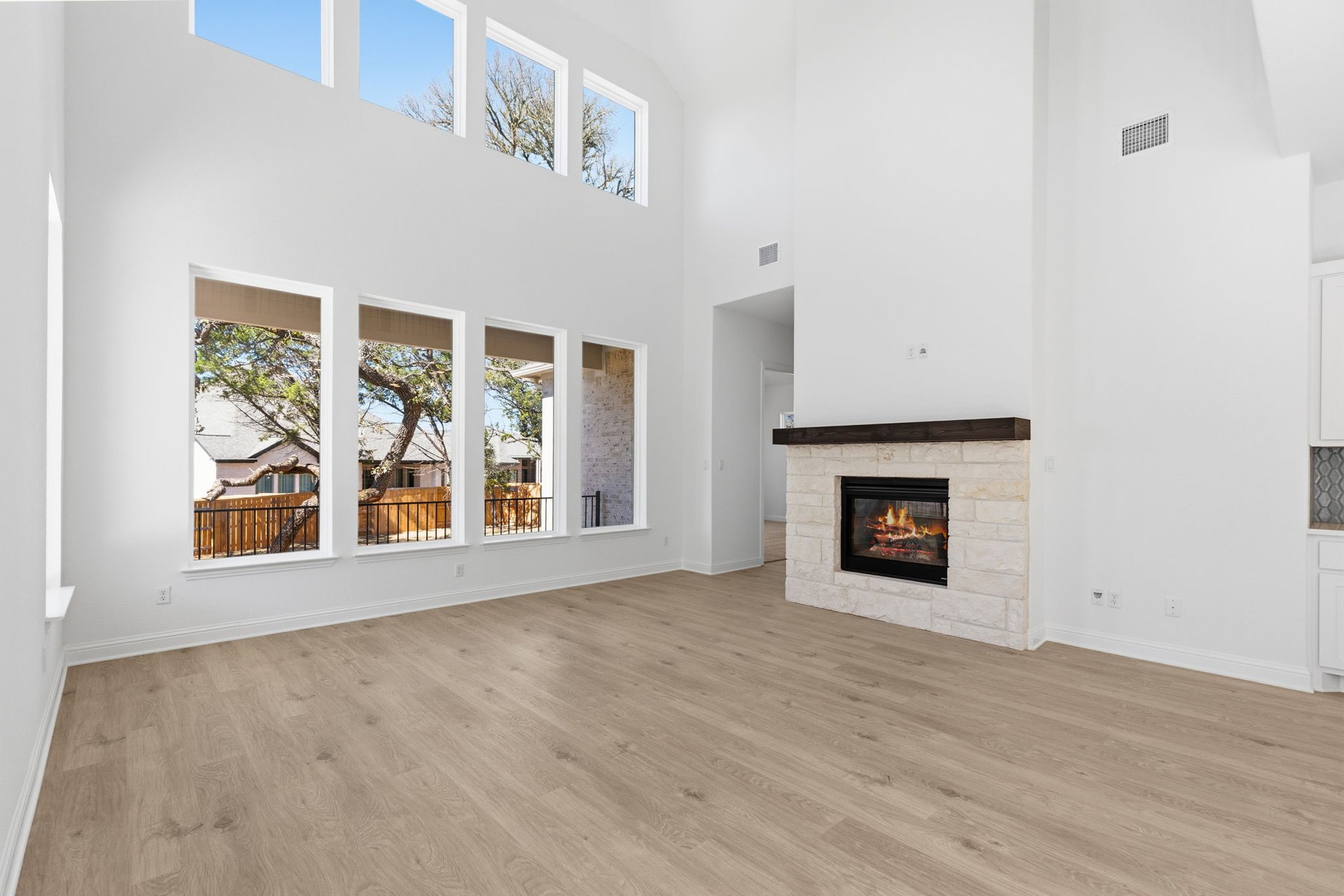 372 Wood Thrush Run Kyle, TX 78640 - Photo 17 of 38 Family Room with soaring ceiling & fireplace