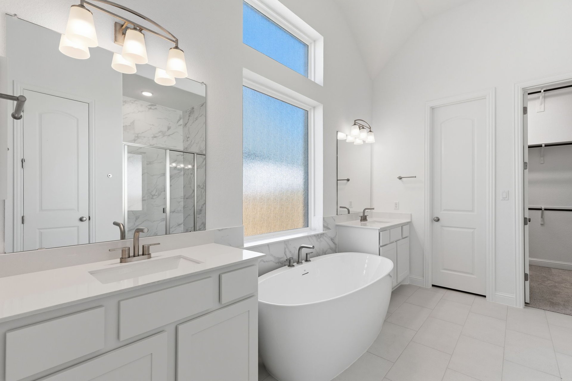 372 Wood Thrush Run Kyle, TX 78640 - Photo 21 of 38 Primary Bath retreat with dual vanities & soaking tub