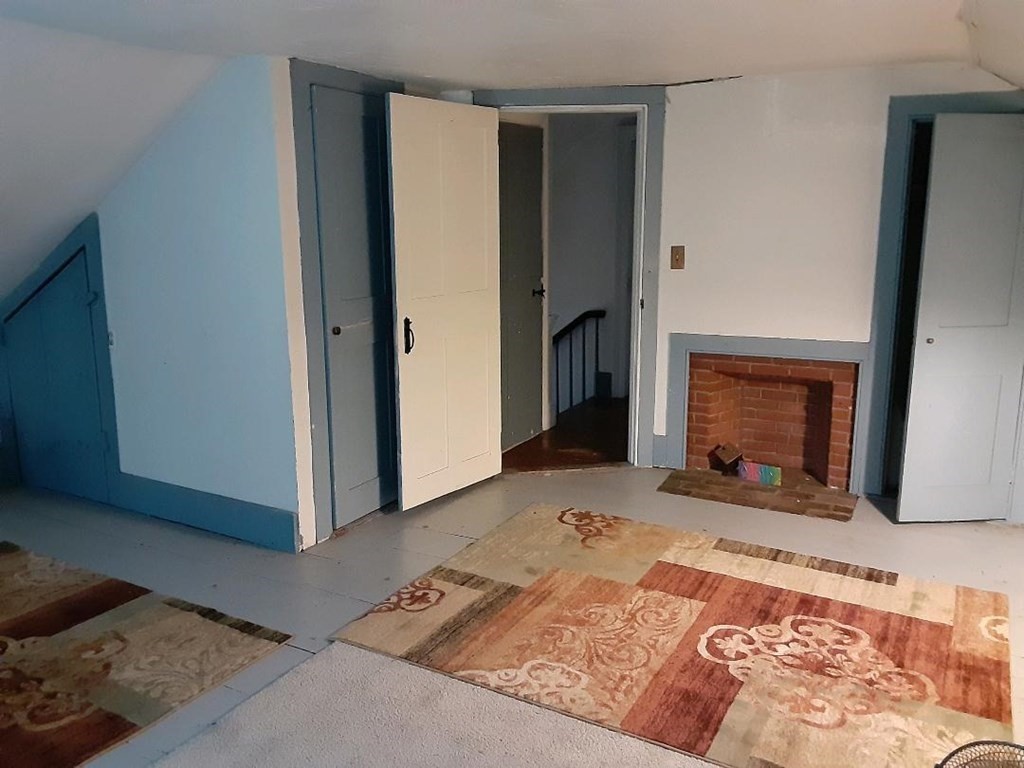 160 Hall Road Winchendon, MA 01475 - Photo 11 of 35 a view of a livingroom with a fireplace and cabinet in a room
