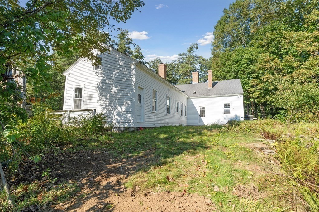 160 Hall Road Winchendon, MA 01475 - Photo 17 of 35 a house is sitting in middle of the green field