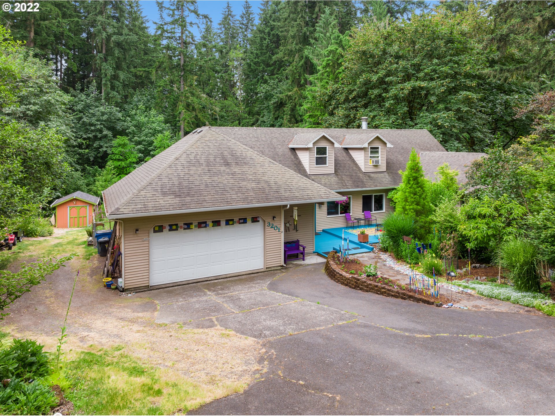 3201 Northwest 199th Street Ridgefield, WA 98642 - Photo 1 of 32 a front view of a house with a yard and garage