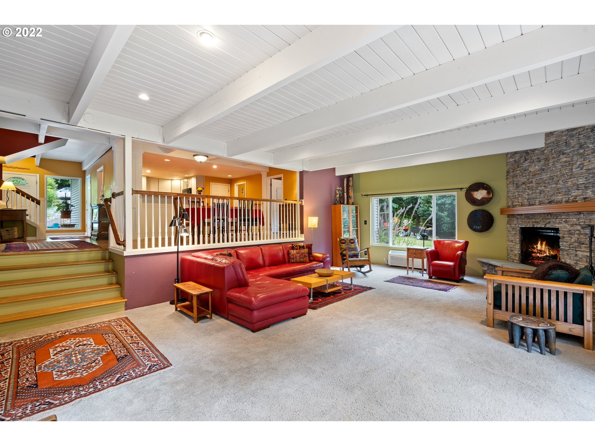 3201 Northwest 199th Street Ridgefield, WA 98642 - Photo 13 of 32 a living room with furniture and a floor to ceiling window