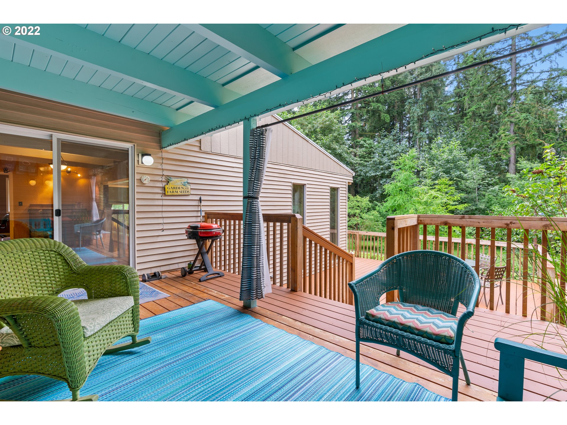3201 Northwest 199th Street Ridgefield, WA 98642 - Photo 24 of 32 a balcony with wooden floor table and chairs