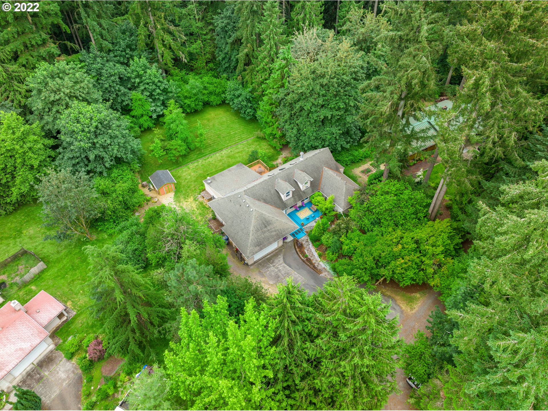 3201 Northwest 199th Street Ridgefield, WA 98642 - Photo 32 of 32 an aerial view of a house with a yard and trees all around