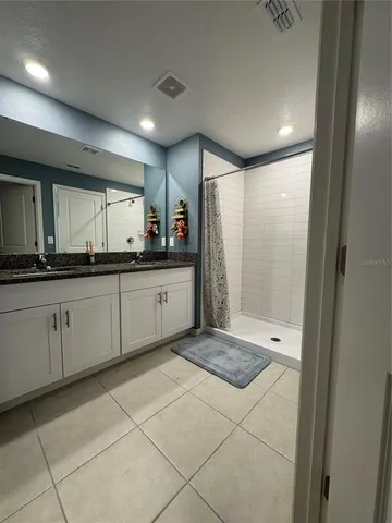 a bathroom with a shower and a tub