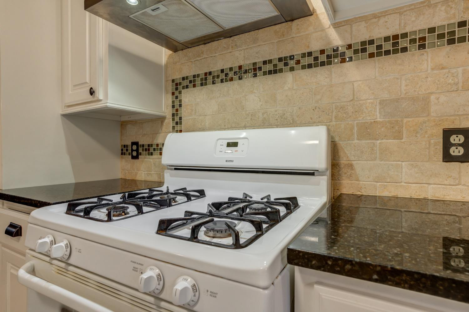 3415 27th Street Lubbock, TX 79410 - Photo 16 of 30 a white stove top oven sitting inside of a kitchen