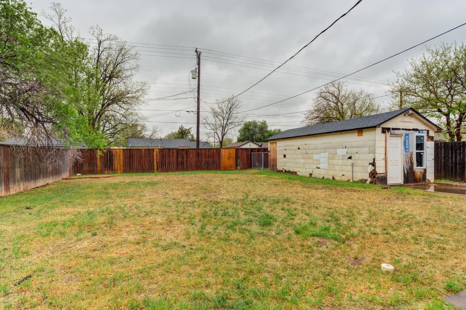 3415 27th Street Lubbock, TX 79410 - Photo 29 of 30 a view of a house with backyard and a tree