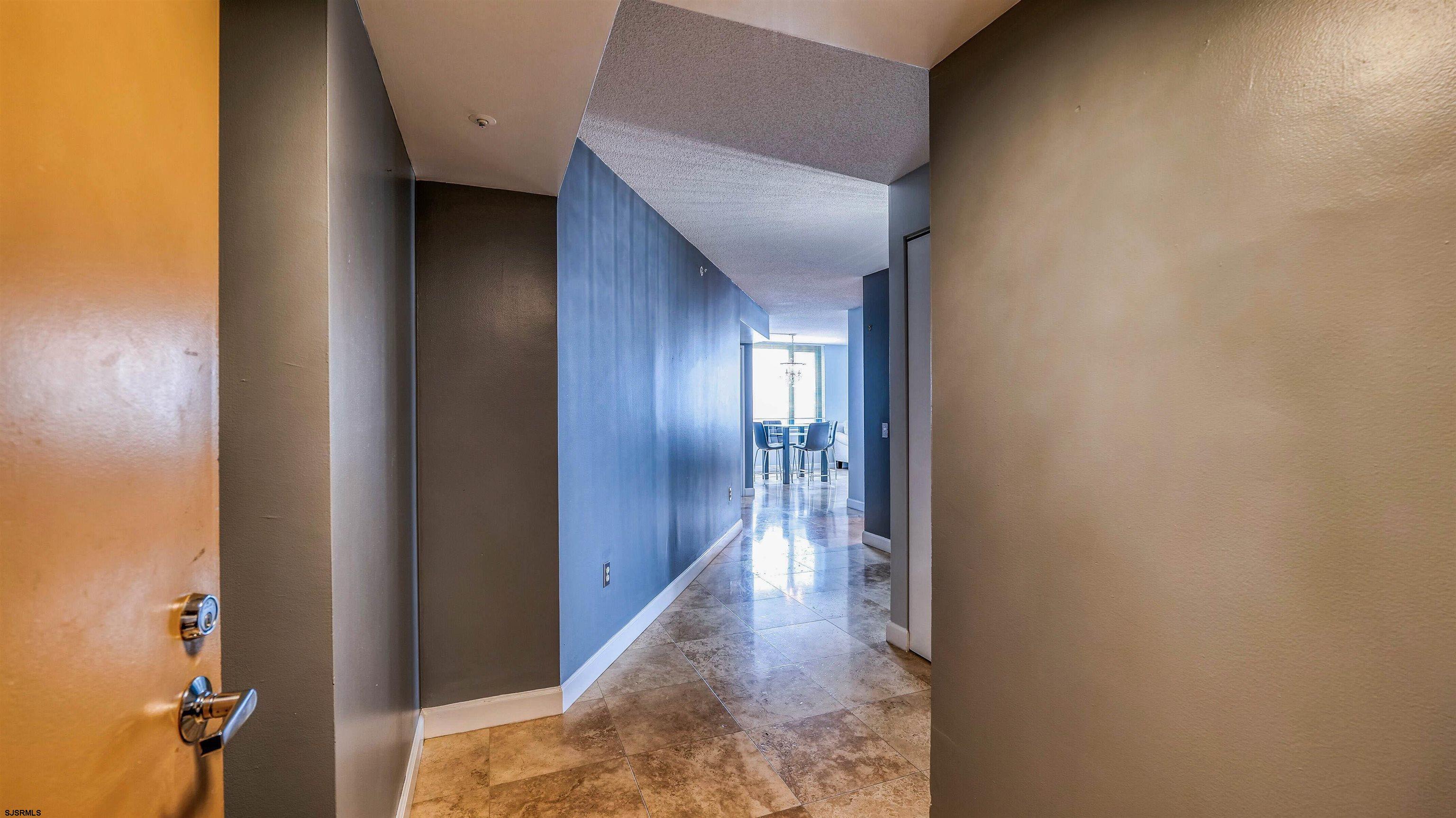 526 Pacific Avenue, Unit 903 Atlantic City, NJ 08401 - Photo 14 of 43 a view of a hallway with wooden floor