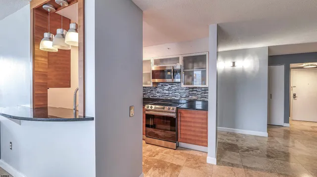 a bedroom with a bed and a mirror on dresser
