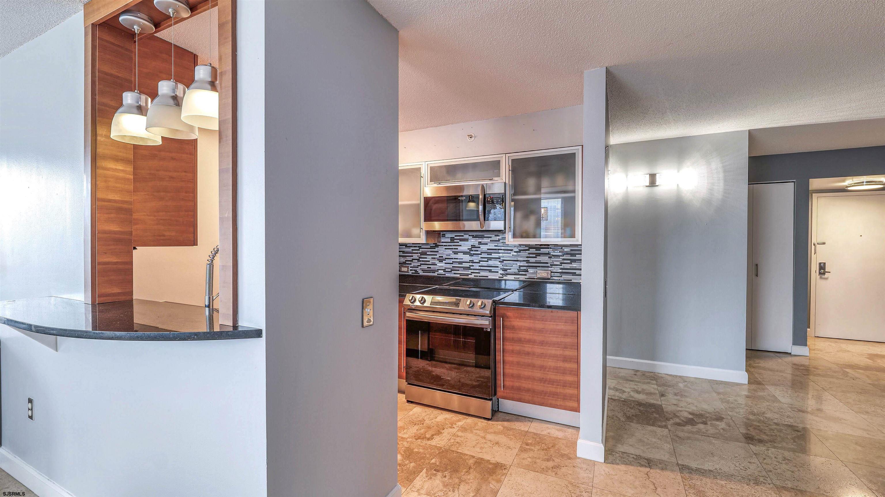 526 Pacific Avenue, Unit 903 Atlantic City, NJ 08401 - Photo 18 of 43 a bathroom with a sink and a mirror