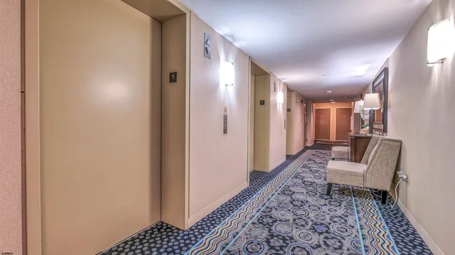 a bathroom with a bathtub and a rug