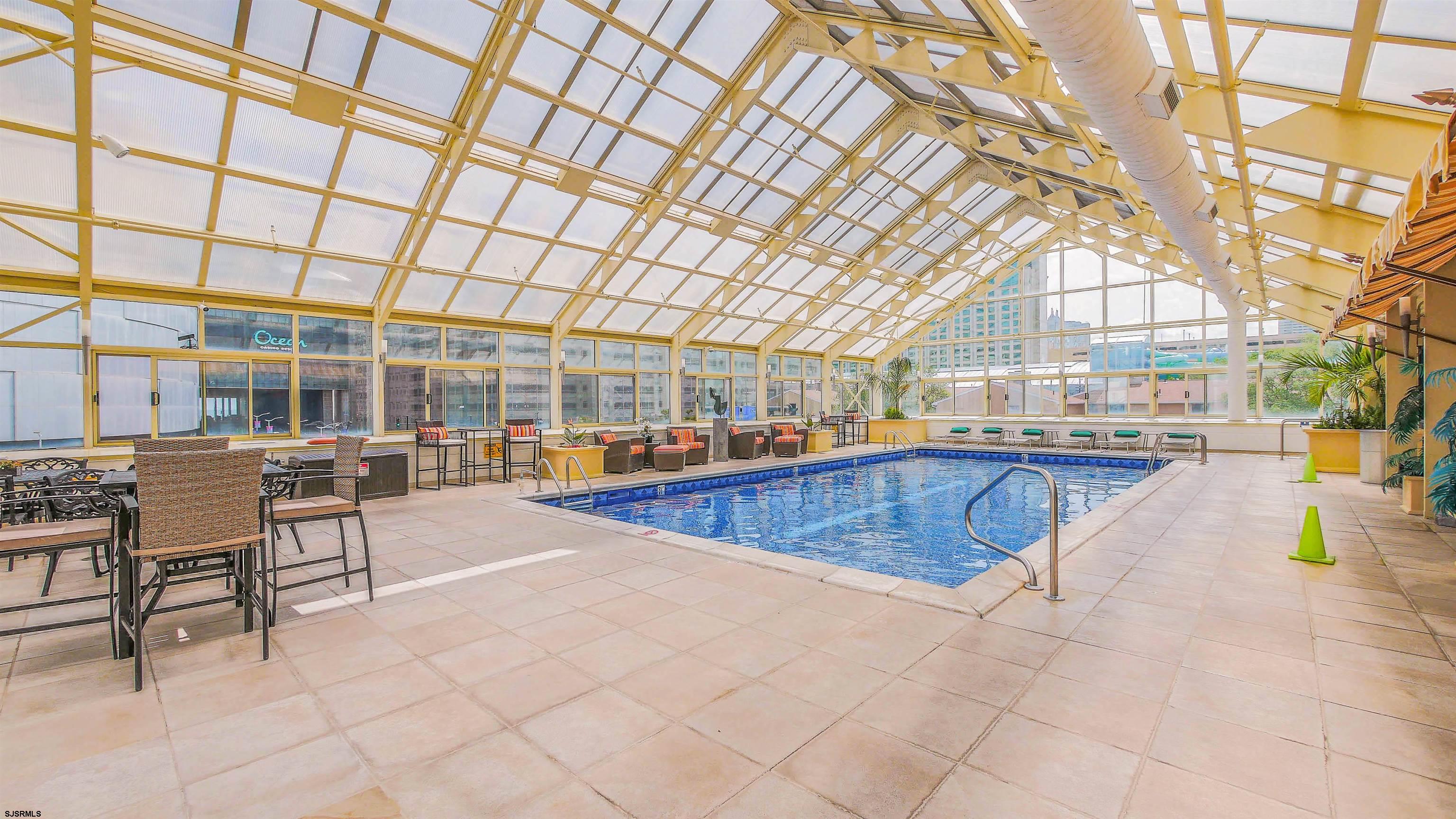 526 Pacific Avenue, Unit 903 Atlantic City, NJ 08401 - Photo 37 of 43 a swimming pool with outdoor seating and yard