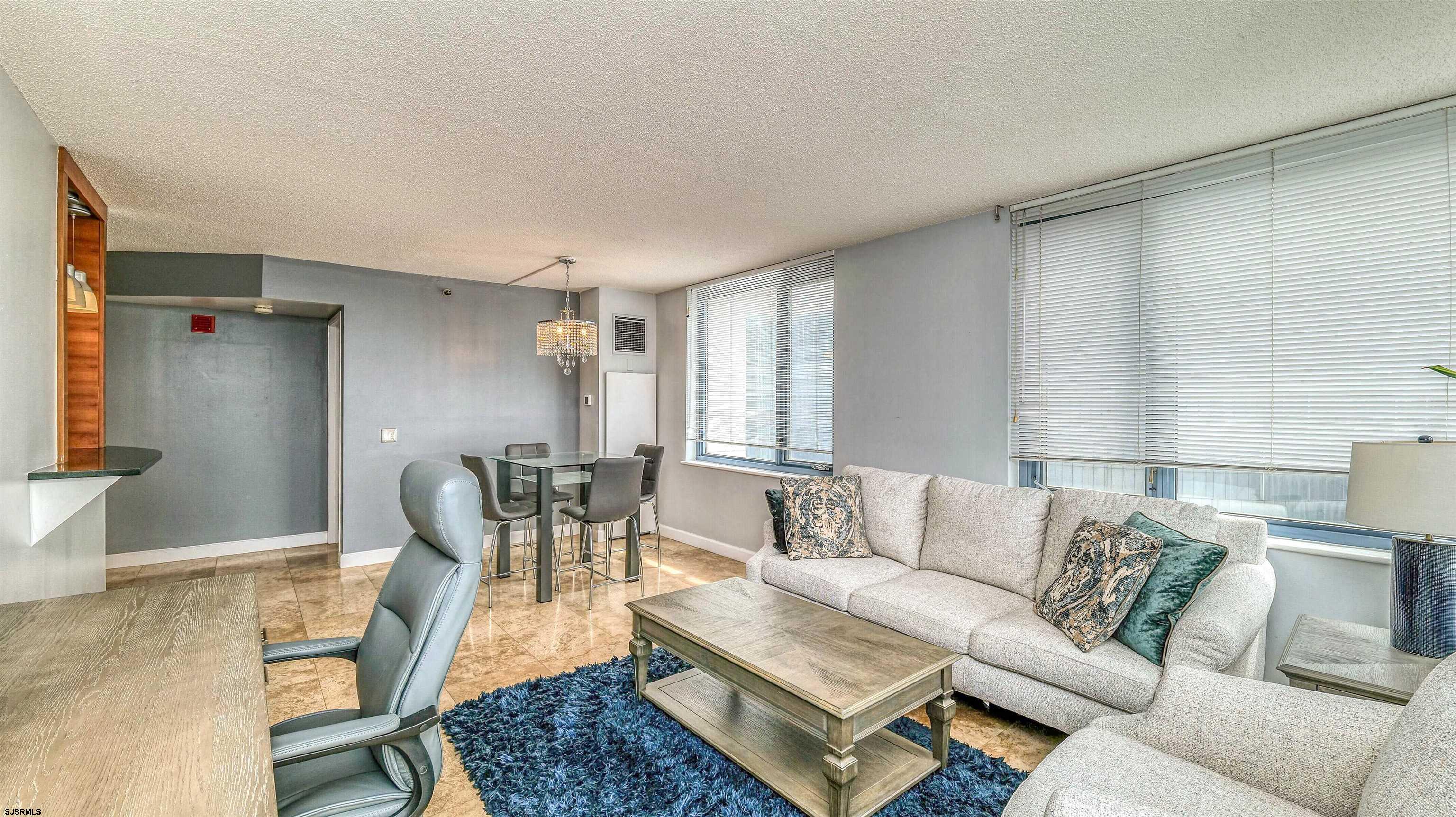 526 Pacific Avenue, Unit 903 Atlantic City, NJ 08401 - Photo 6 of 43 a living room with furniture and a table