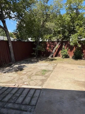 a view of wooden fence and trees
