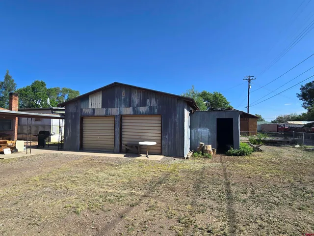 a view of a backyard with furniture