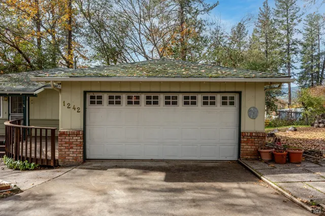 a view of a house with wooden fence